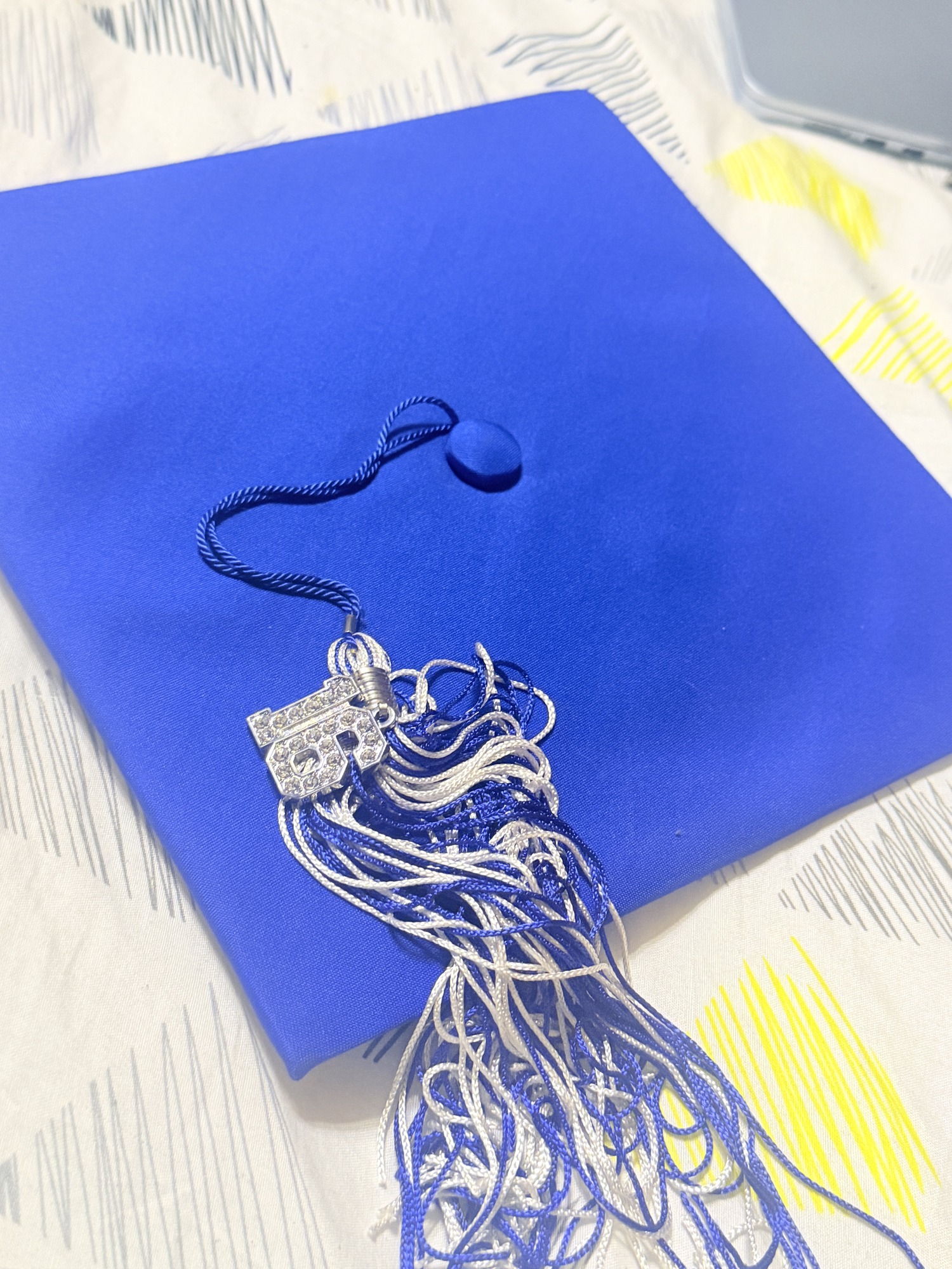 Jaylen Sinegal’s graduation cap, tassel, and honor cords after graduating from Erath High School at 17